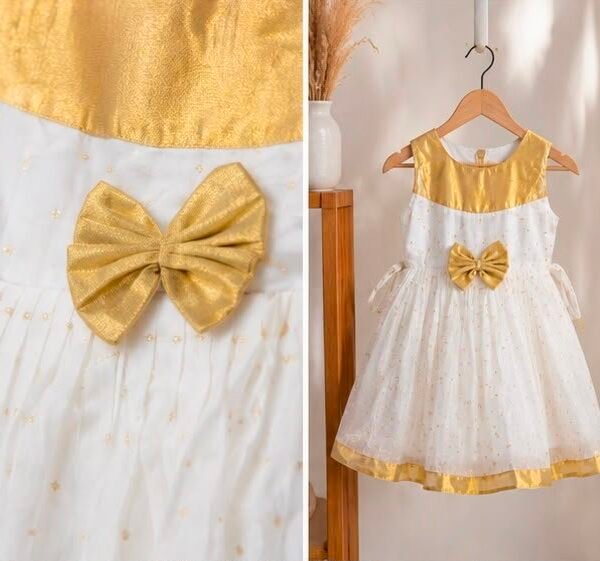 Charming Off-White & Gold Baby Frock with Front Bow Accent